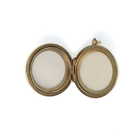 Open oval locket, 9K yellow gold.