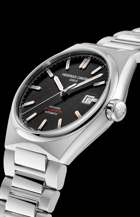 Stainless steel watch, black dial, silver markers.
