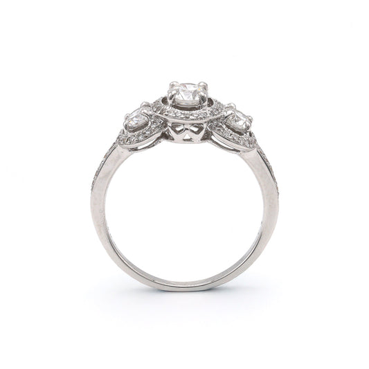 Three stone halo diamond engagement ring.