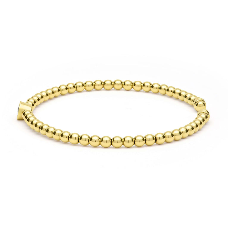 Gold beaded cuff bracelet with diamonds.
