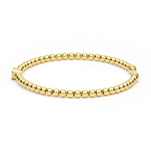 Gold beaded cuff bracelet with diamonds.