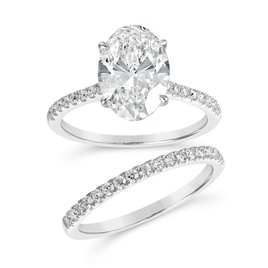 Oval diamond engagement ring, white gold band.