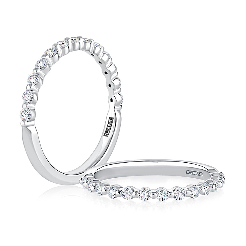 Stackable white gold diamond wedding band.