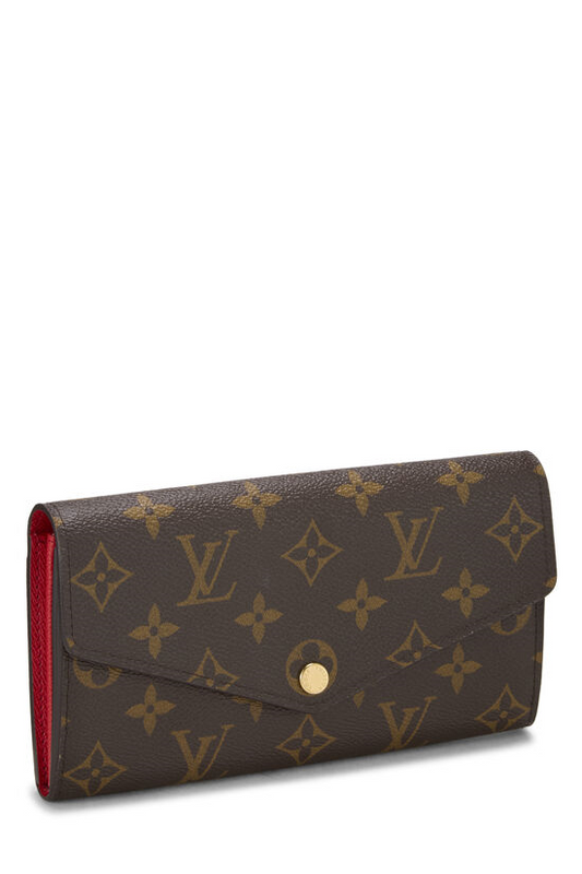 Brown leather wallet with red interior.