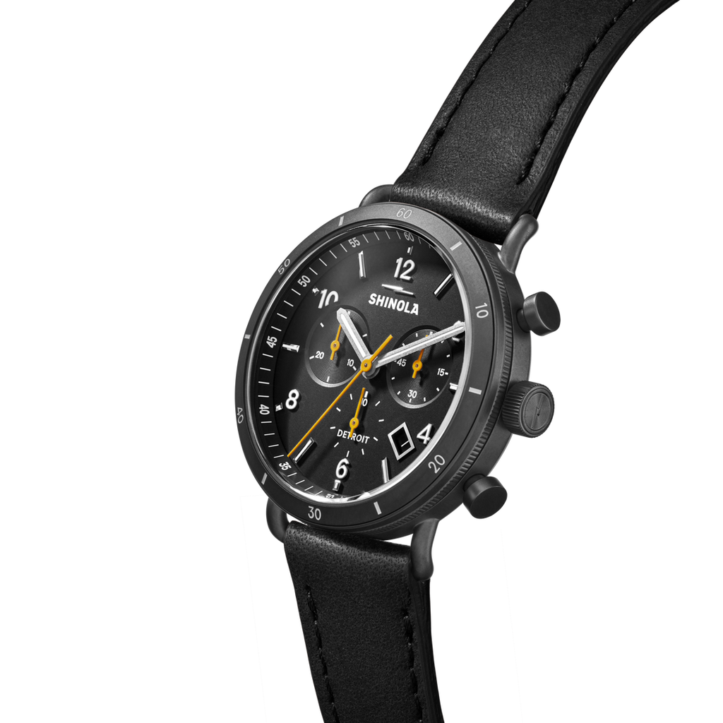 Black dial chronograph watch with leather strap.