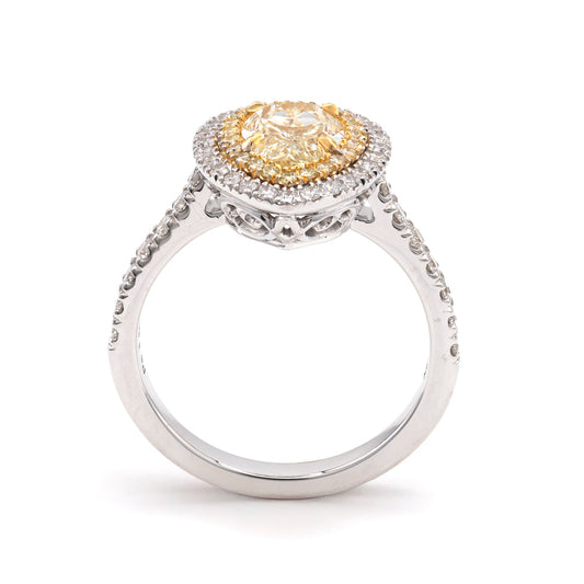 Yellow pear diamond halo engagement ring.