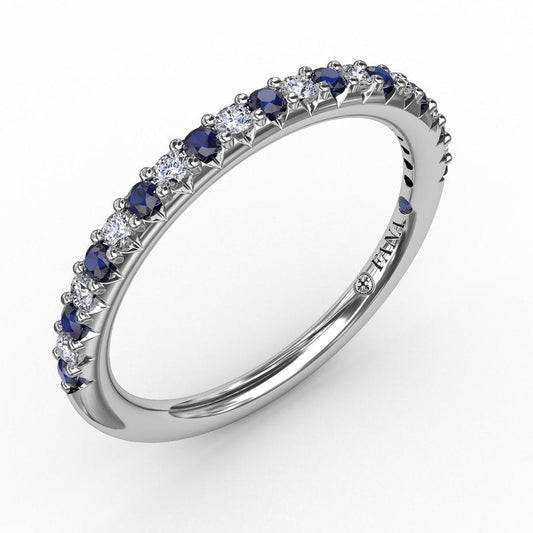Blue sapphire and diamond band in white gold.
