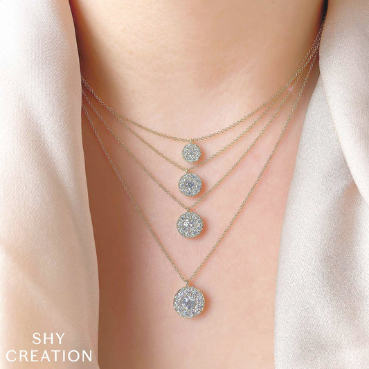 Layered yellow gold diamond circle necklaces.