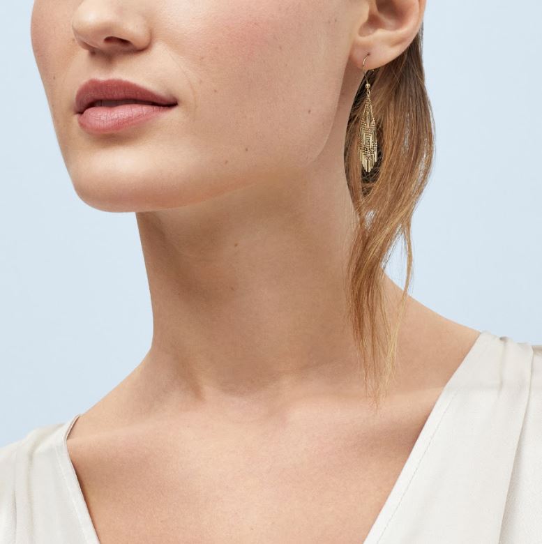 Gold knot earrings with nugget finish.