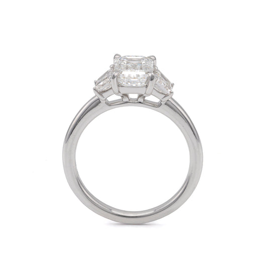Three-stone white gold engagement ring.