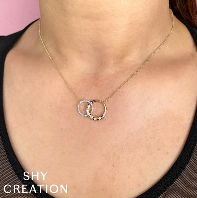 Two-tone gold necklace with diamond circles.
