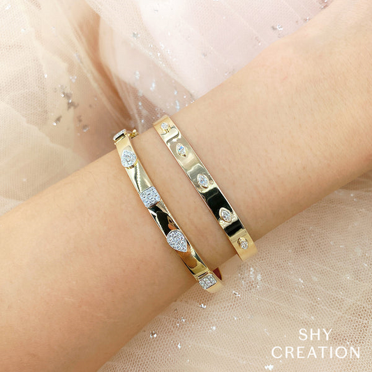Gold bracelet with marquise-cut diamonds.