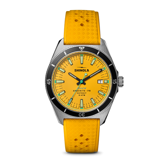 Yellow-dial watch with yellow rubber strap.