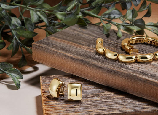 14K yellow gold huggie earrings, polished finish.