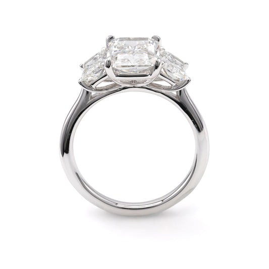 Three-stone white gold engagement ring.