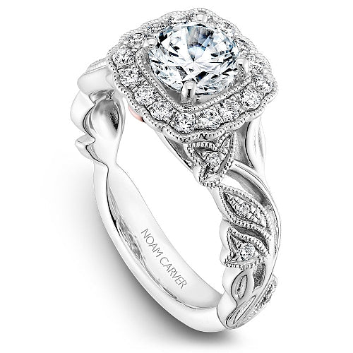 Floral halo diamond ring in white gold.