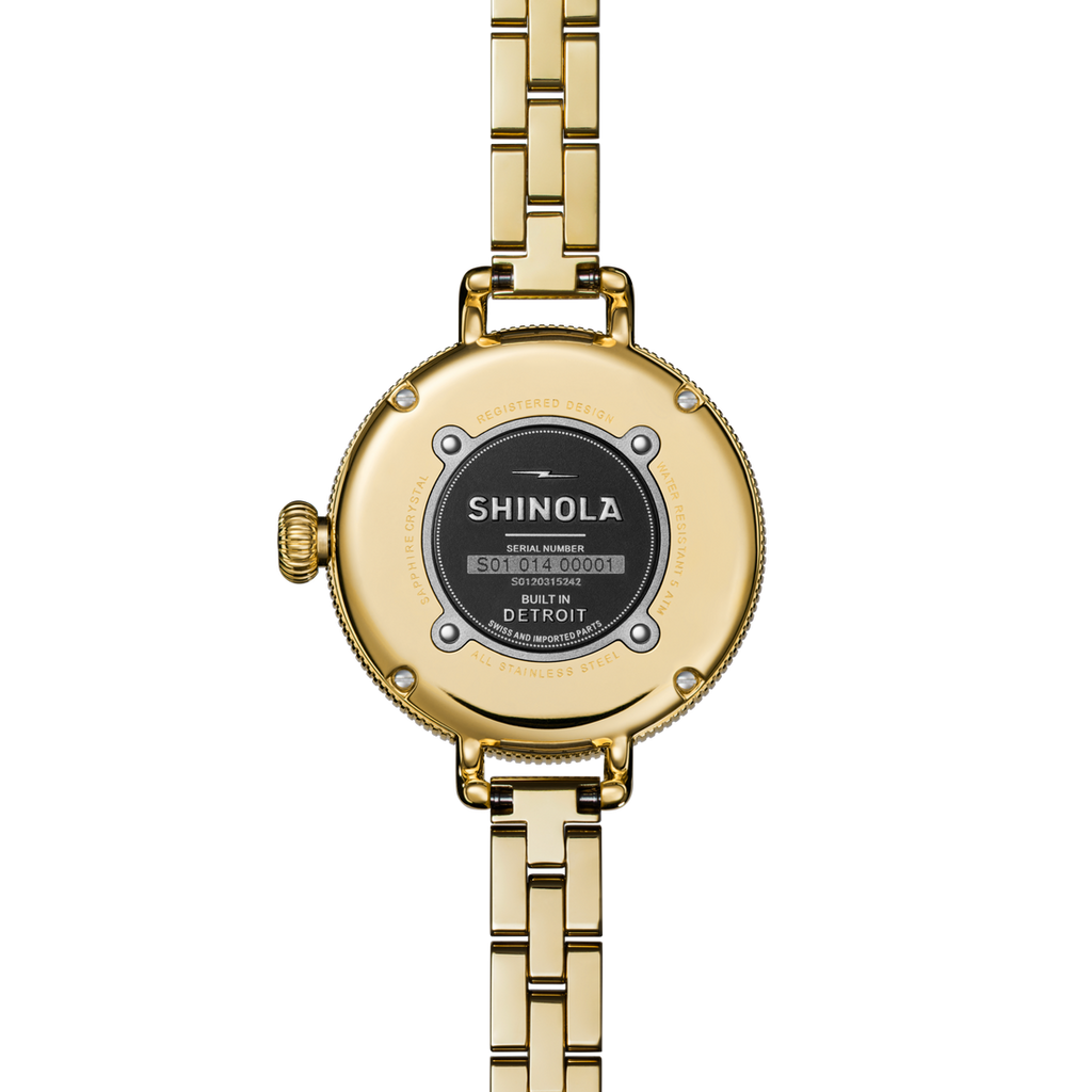 Gold-tone stainless steel watch back.