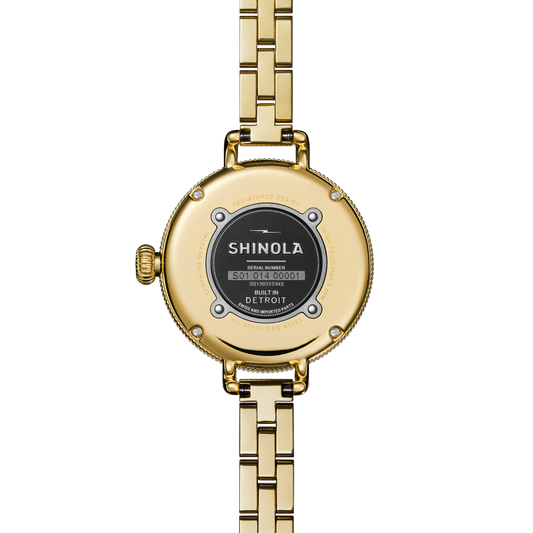 Gold-tone stainless steel watch back.
