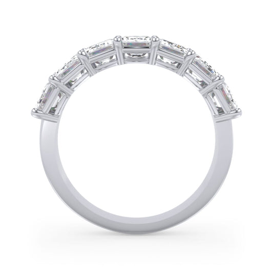 Seven emerald-cut diamonds in white gold band.