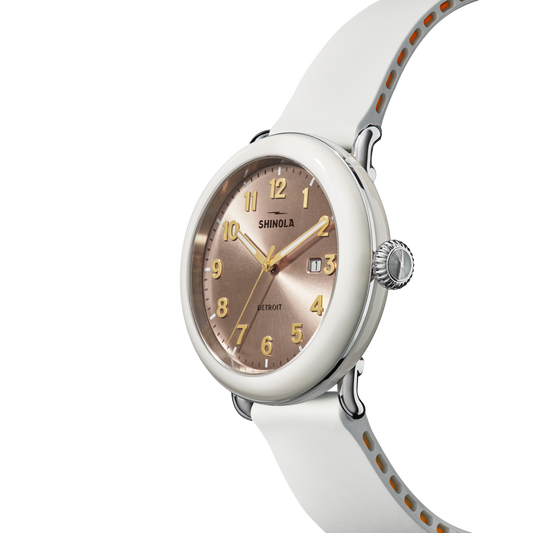 Rose dial, stainless steel case, white rubber band.
