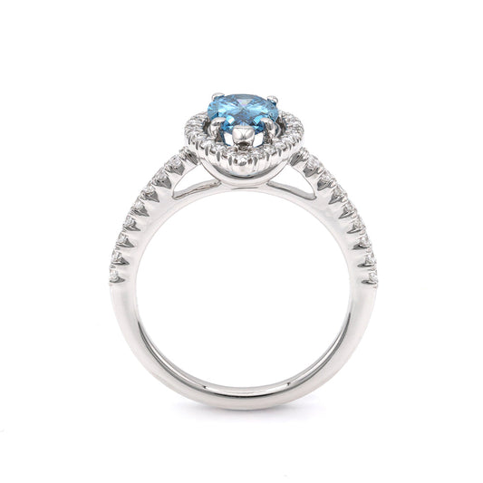 Blue diamond halo engagement ring, white gold.