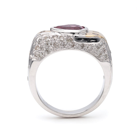 Pear-shaped pink sapphire ring with diamonds.