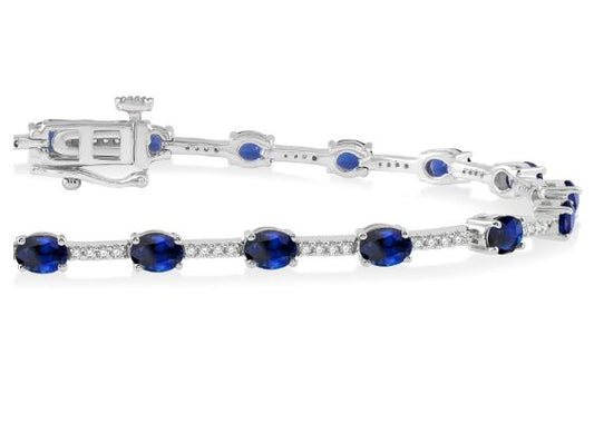 Oval sapphire and diamond station bracelet.