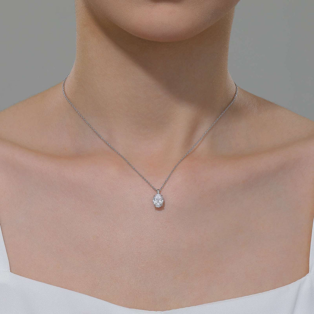 Oval simulated diamond pendant, platinum-bonded silver chain.