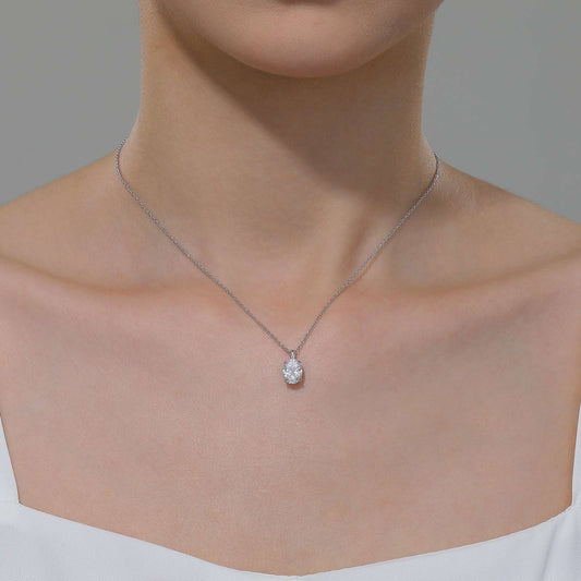 Oval simulated diamond pendant, platinum-bonded silver chain.