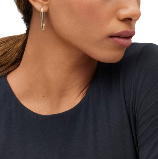 14K yellow gold polished large hoop earrings.