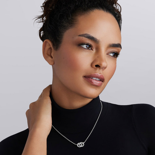 Diamond necklace with interlocking circle pendant.