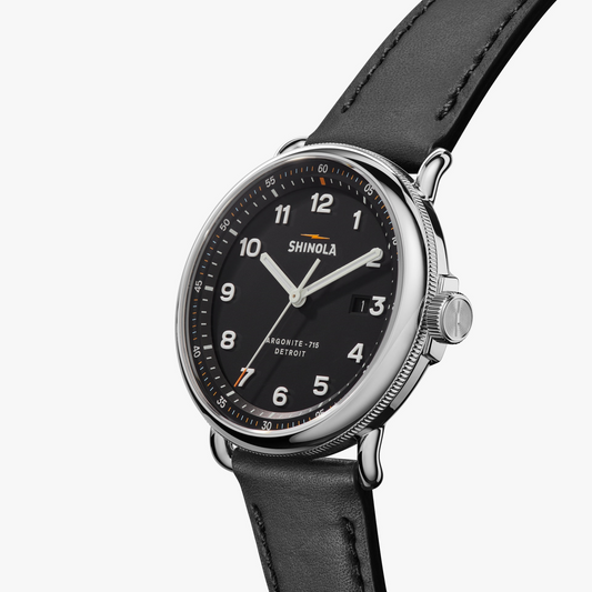 Black dial watch, stainless steel case, leather strap.