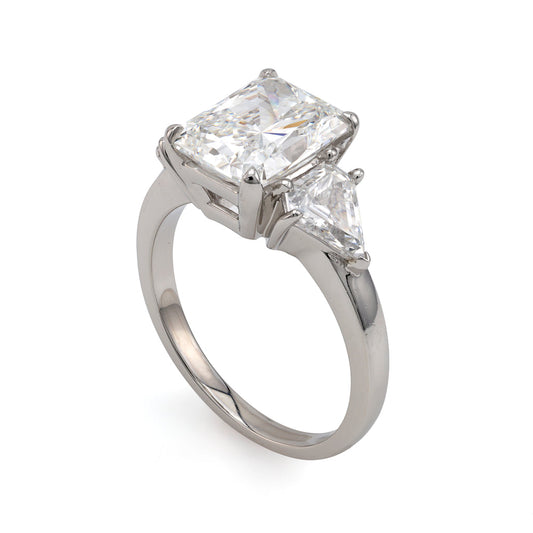Platinum ring with radiant diamond centerpiece.