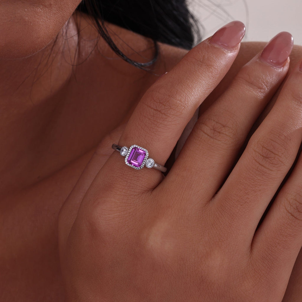 Emerald-cut pink tourmaline ring with diamonds.