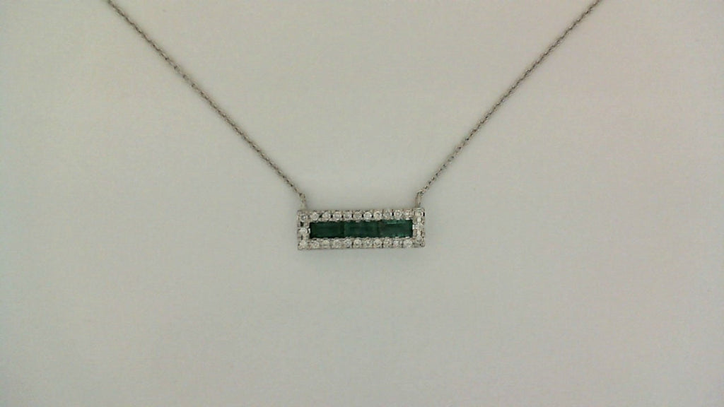 Bar necklace with emeralds and diamonds.