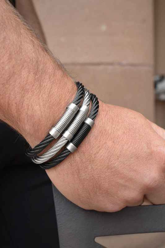 Stainless steel and black cable bangle bracelet.