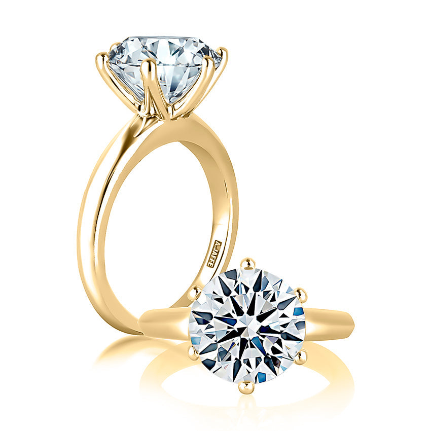 Yellow gold solitaire diamond engagement ring.