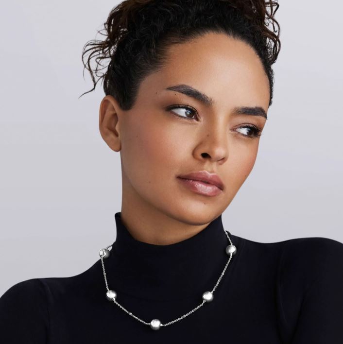 Sterling silver station necklace with beads.