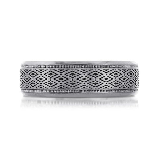 Tantalum band with geometric carved pattern.