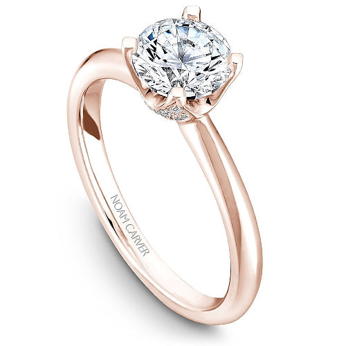 Rose gold ring with solitaire diamond.