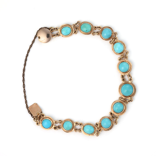 14K gold bracelet with turquoise cabochons.