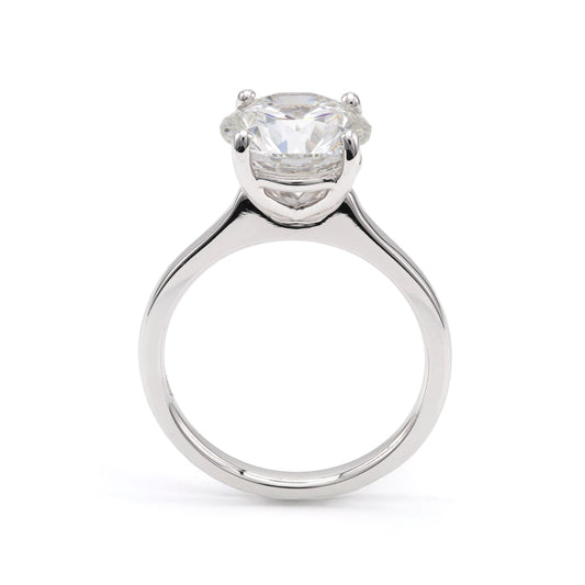 18K white gold ring with round diamond.