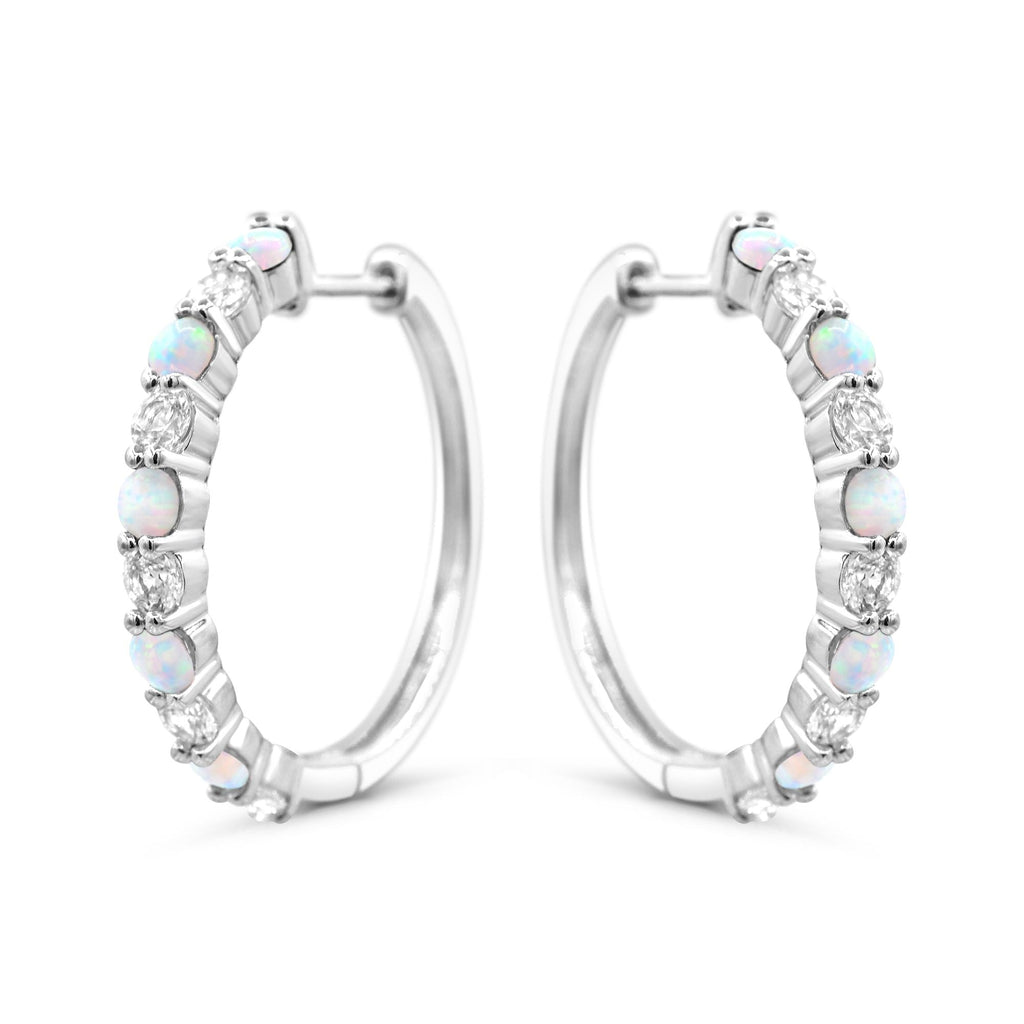 Sterling silver hoops with opals and sapphires.