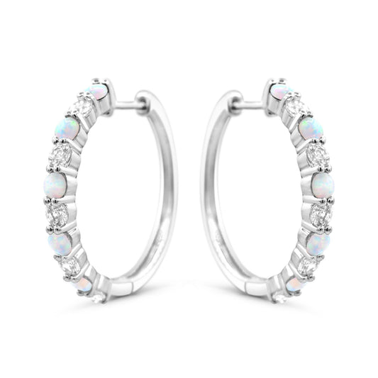 Sterling silver hoops with opals and sapphires.