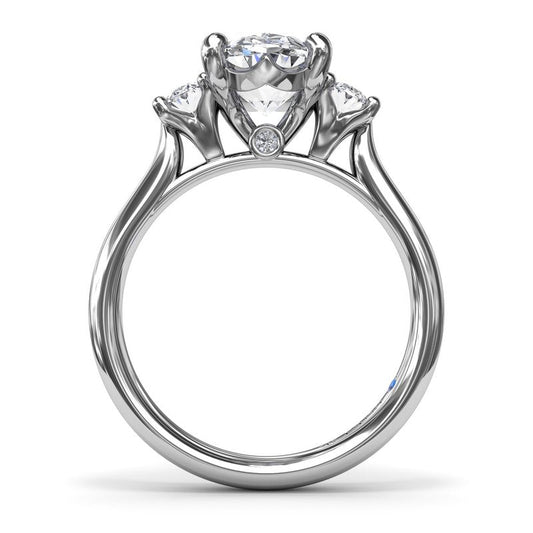 Three-stone diamond engagement ring in tan gold.