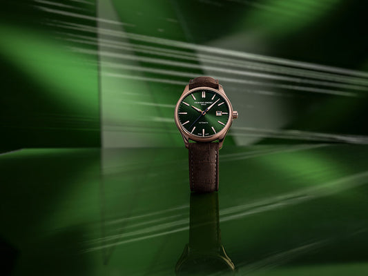 Green-dial watch with brown leather strap.