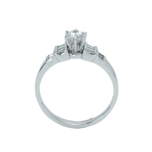 Platinum ring with round and baguette diamonds.