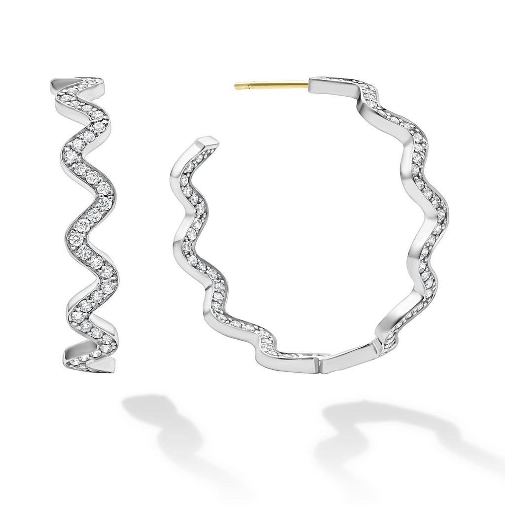 Wavy sterling silver hoop earrings with diamonds.