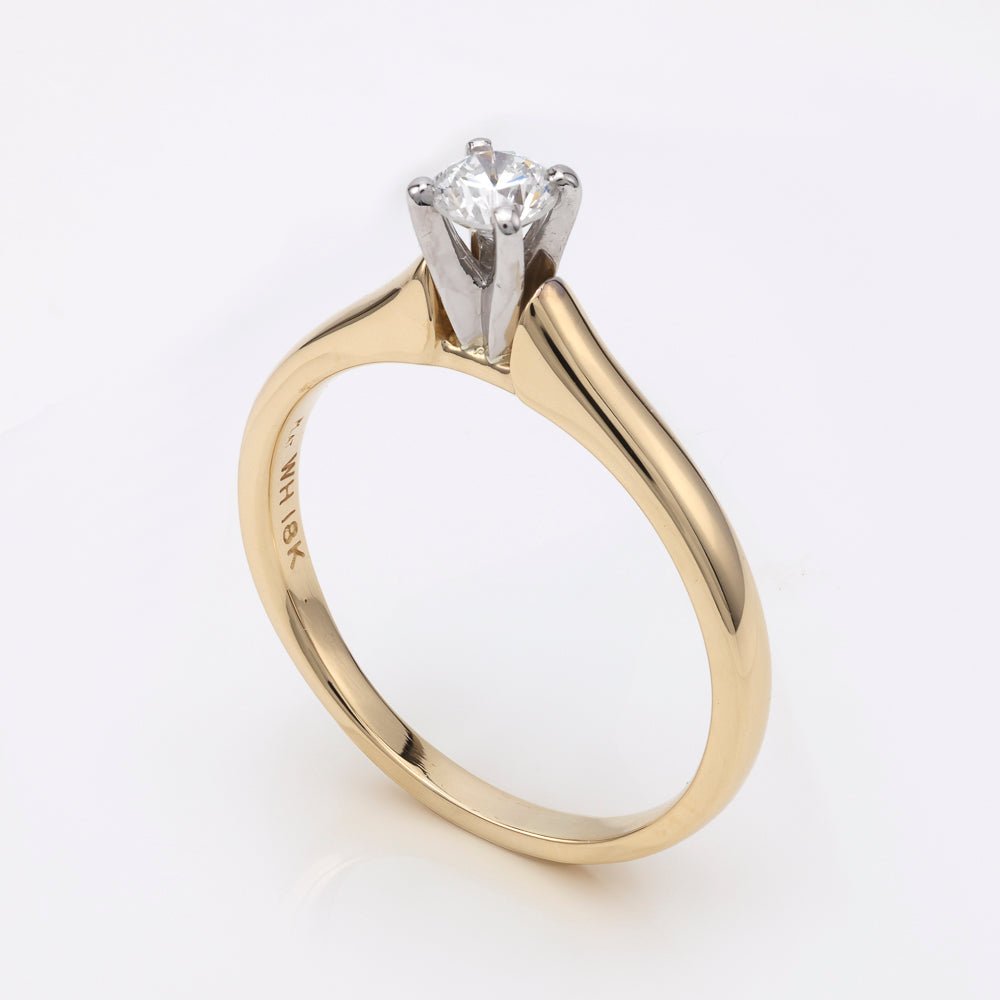18K platinum yellow diamond solitaire ring.