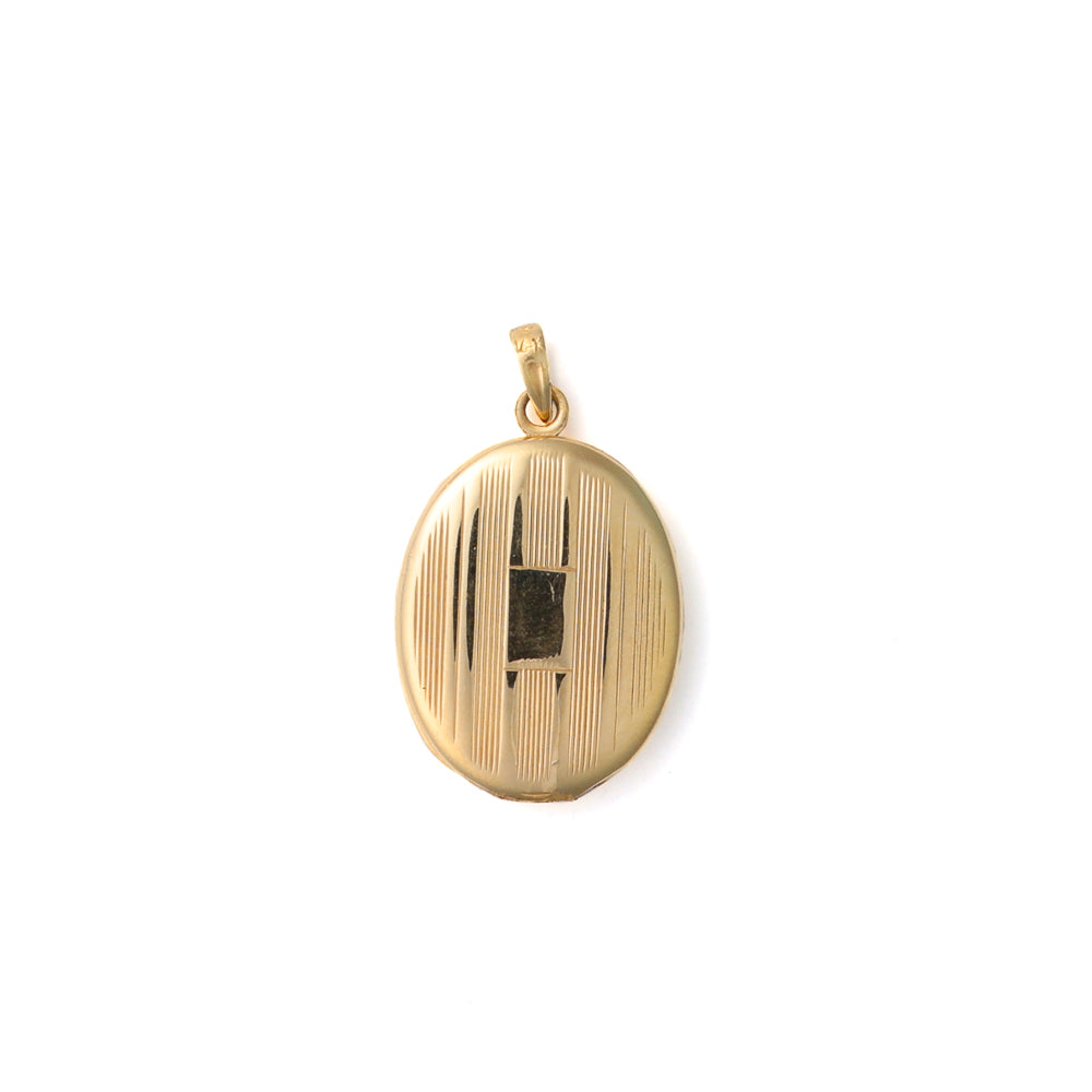 14K yellow gold oval locket with grooves.